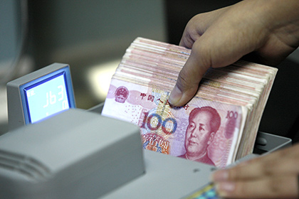 Китай вновь девальвировал свою национальную валюту
